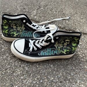 Size 8.5-9 women’s high top customized converse. Good condition. “Tattoo” themed